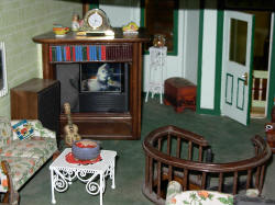 Tiny Tv set continually playing Wizard of Oz